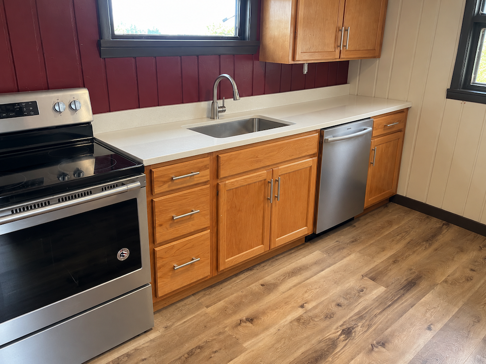 Finished kitchen with new cabinets, countertop, sink and dishwasher