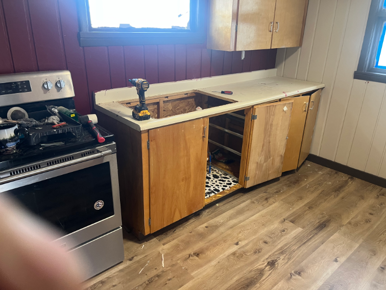 Kitchen with old cabinets torn out before the remodel