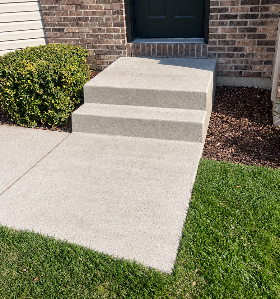 New poured concrete entry steps and walkway